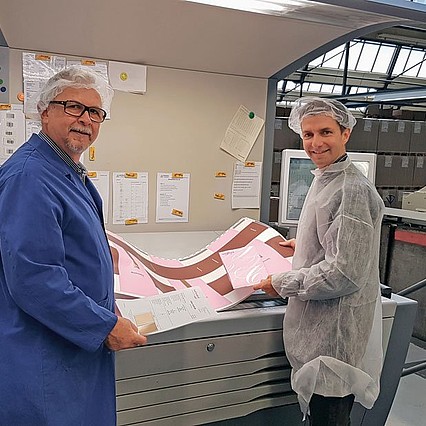 Markus Peter (left), co-owner of CAG Stans, and Matthias Bachmann checking the colour of the cardboard packaging.